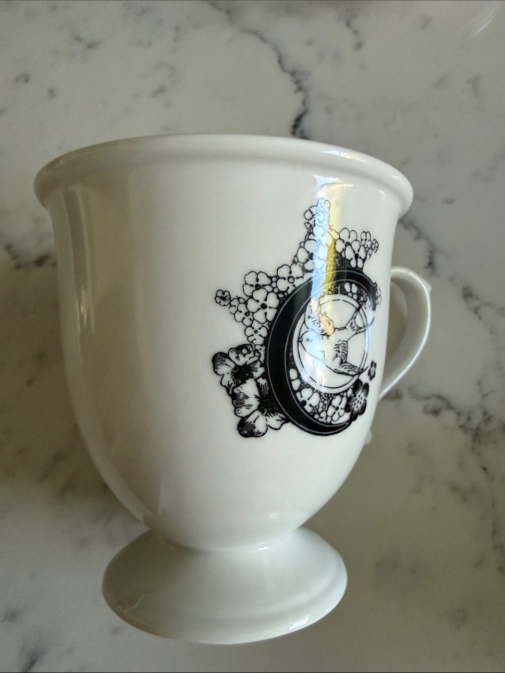Anthropologie White Ceramic Pedestal Mug with Black Floral Monogram